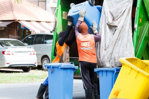 Team members efficiently clearing a flat